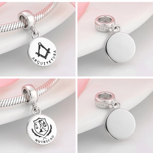 Detailed view of S925 sterling silver charms featuring Architecture and Nutrition emblems