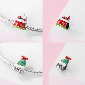 Detailed views of S925 sterling silver Christmas house and tree charms on a snake chain