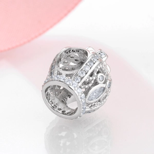 Macro shot of S925 sterling silver crown charm with sparkling cubic zirconia stones