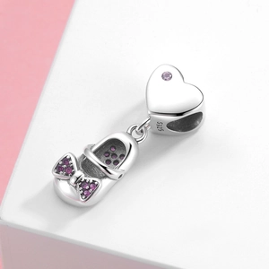 Pendentif tong en argent S925 avec nœud en zircon rose sur fond rose et blanc