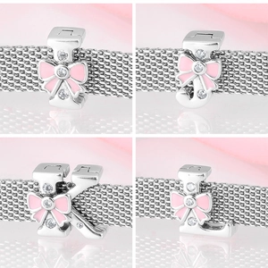 Detailed macro view of S925 silver pink bow alphabet charms I J K L on a mesh bracelet