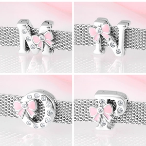 Detailed view of 925 silver alphabet charms M N O P with pink enamel bows and zircons