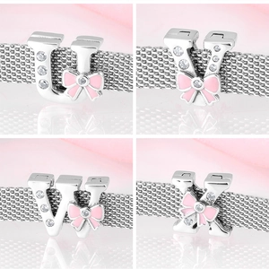 Detail of S925 silver alphabet charms U V W X with pink bows and clear zircon stones
