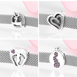 Detailed view of S925 sterling silver charms with reindeer and heart-shaped designs
