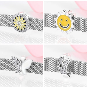 Detail shots of S925 silver sunflower and butterfly charms with yellow enamel and zircons