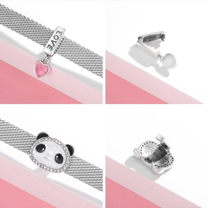 Close-up of S925 sterling silver heart charm and panda clip on a mesh bracelet