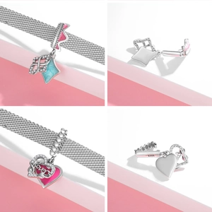 Macro view of 925 sterling silver heart charm with pink enamel and love engraving