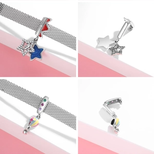 Detail of 925 sterling silver hot air balloon and star charms on a mesh bracelet