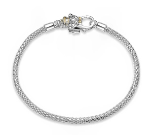 Macro detail of S925 sterling silver woven bracelet with lobster clasp and girl charm