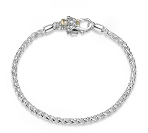 Macro detail of S925 sterling silver lobster clasp with a golden zodiac pig charm