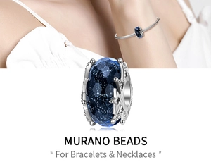 Detailed macro view of deep blue starry Murano glass bead with silver star cutouts