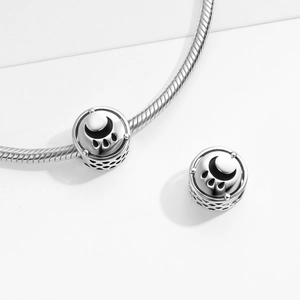 Polished S925 sterling silver moon and cat paw charms on a silver snake chain bracelet