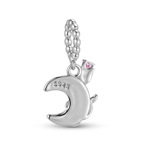 Macro detail of S925 sterling silver crescent moon charm with pink heart gemstone