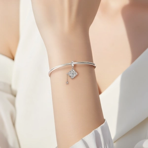 S925 sterling silver graduation cap charm on a classic snake chain bracelet for women