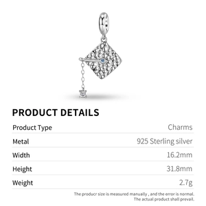 Detailed macro view of S925 sterling silver graduation cap charm with blue zircon stone