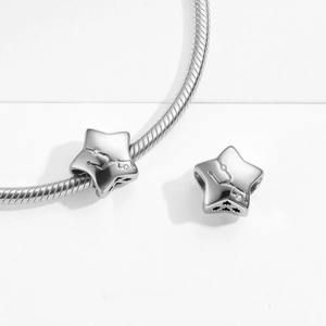 Detail of S925 sterling silver star charms with zodiac engravings and white zircons