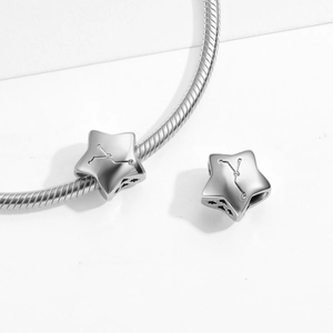 Detailed view of S925 sterling silver star charm with zodiac engraving and zircon