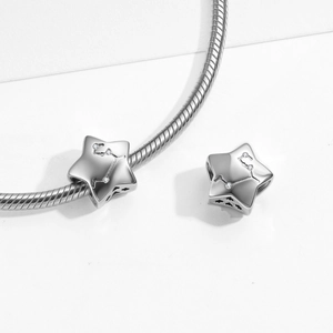 Detail of S925 sterling silver star bead with sparkling cubic zirconia on a snake chain
