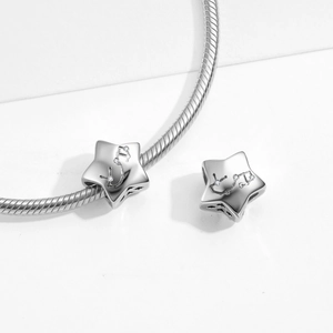 Detailed close-up of S925 sterling silver star charm with cubic zirconia on a snake chain