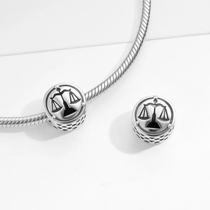 S925 sterling silver Libra scales charm with hollow pattern on snake chain bracelet