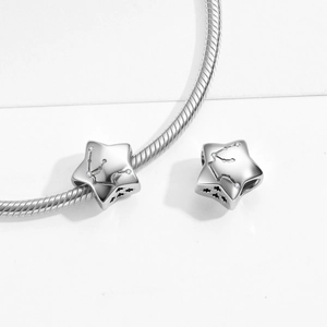 Detailed view of S925 sterling silver star charm with constellation zircons on snake chain