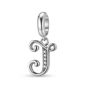 Macro view of vintage S925 sterling silver letter J charm with white zircon stones
