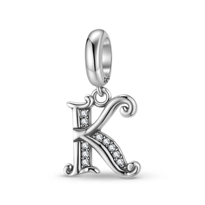 Macro shot of S925 sterling silver letter K charm with sparkling white zircon stones