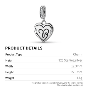 Macro detail of S925 sterling silver heart charm with black enamel and zircons