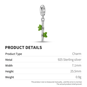 Macro shot of 925 sterling silver bamboo charm with green enamel leaves detail