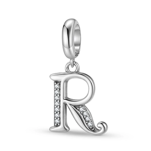 Detailed macro view of an S925 sterling silver letter R charm with pavé cubic zirconia