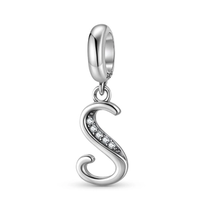 Macro detail of S925 sterling silver S-letter charm with white zircon stones