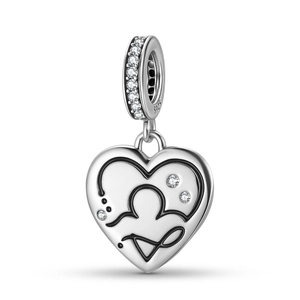 Macro view of S925 sterling silver heart charm with stethoscope pattern and cubic zirconia