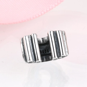Detailed macro view of S925 sterling silver charm bead showing ribbed texture and hallmark