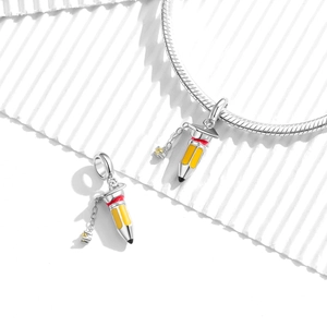S925 sterling silver pencil charm with yellow enamel on a silver snake chain bracelet