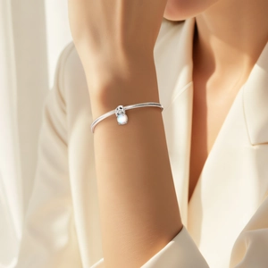 Elegant S925 sterling silver snake chain bracelet with moonstone koala charm