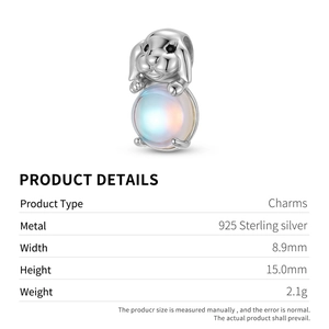 Detailed macro view of S925 sterling silver rabbit charm with iridescent moonstone