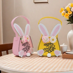 Pink and yellow felt Easter bunny baskets with floral details and Happy Easter text