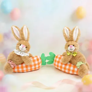 Detail of plush Easter bunnies holding orange plaid carrots with lace and bow accents