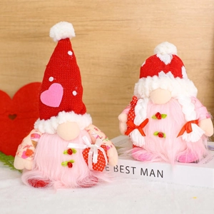 Handmade glowing Valentine Gnomes with knitted hats and hearts for holiday home decor