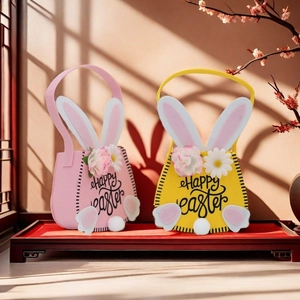 Felt Easter bunny gift bags with Happy Easter text and floral details on wooden tray