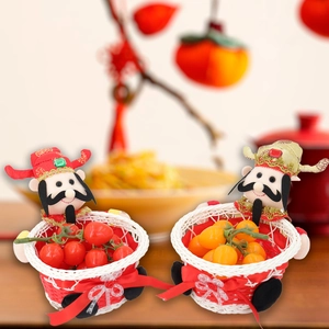 Traditional Chinese New Year candy baskets with God of Fortune dolls for festive decoration