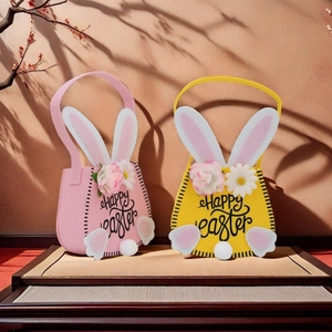 Detailed view of pink and yellow Easter felt baskets with rabbit ears and Happy Easter print