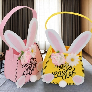 Detail of pink and yellow felt Easter bunny bags with 3D floral accents and fuzzy tails