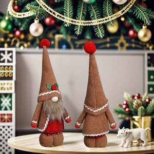 Gingerbread Christmas gnome doll set with pointed hats and festive winter decor