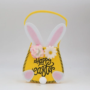 Close-up of yellow felt Easter bunny gift bag with Happy Easter text and floral accents