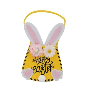 Yellow felt Easter bunny gift bag with long ears and Happy Easter text on white background