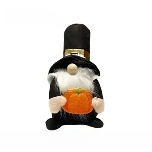 Gnome plush with orange pumpkin, white beard and black hat, dimensions 12x11x20 cm
