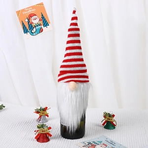 Christmas gnome wine bottle cover with red striped knitted hat and white faux fur beard