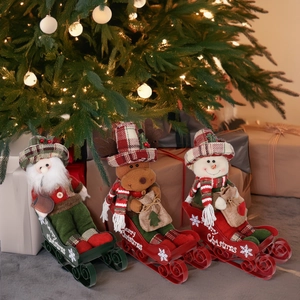 Three-piece Christmas sled decor set with Santa, elk, and snowman in red green plaid