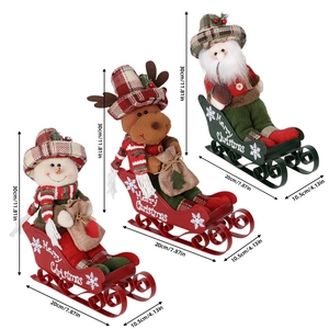 Three Christmas plush figures in metal sleds featuring Santa, Reindeer, and Snowman décor